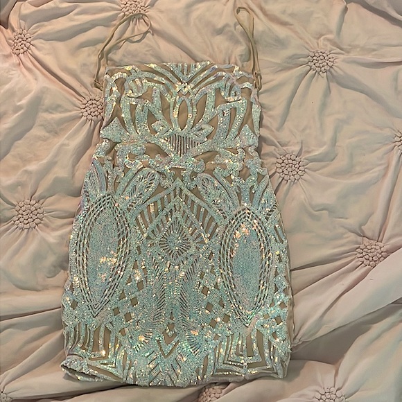 A dress that is good for homecoming! It has a design and is a tanish color - Picture 1 of 2